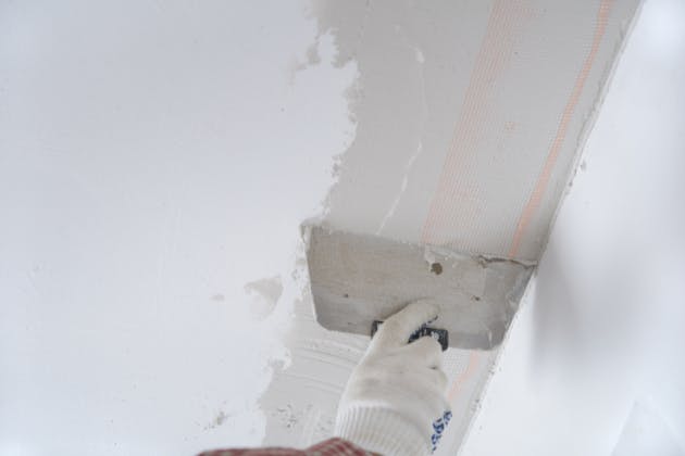 Can you plaster over artex ceilings safely?